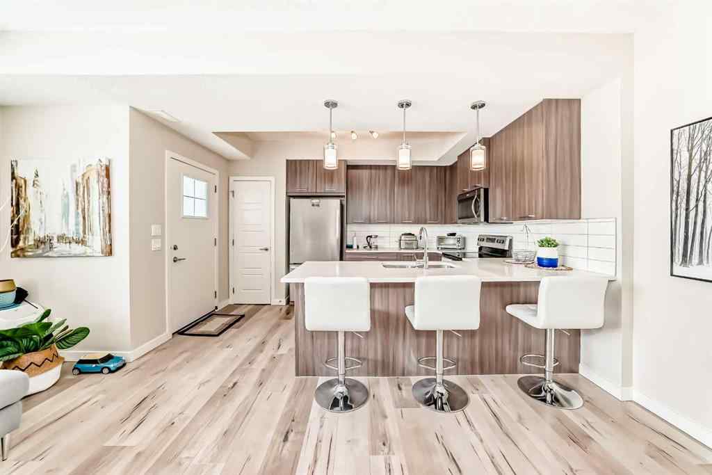 MLS® A2228177 - Unit #104 115 Sagewood Drive SW in Canals Airdrie, Residential