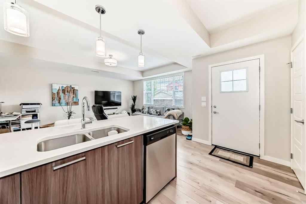MLS® A2228177 - Unit #104 115 Sagewood Drive SW in Canals Airdrie, Residential