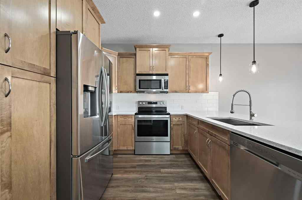 MLS® A2228362 - 102 Ravenscroft Green SE in Ravenswood Airdrie, Residential