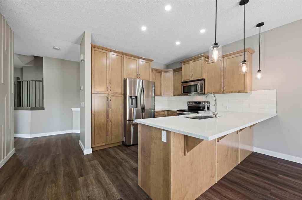 MLS® A2228362 - 102 Ravenscroft Green SE in Ravenswood Airdrie, Residential