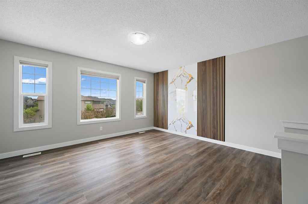 MLS® A2228362 - 102 Ravenscroft Green SE in Ravenswood Airdrie, Residential