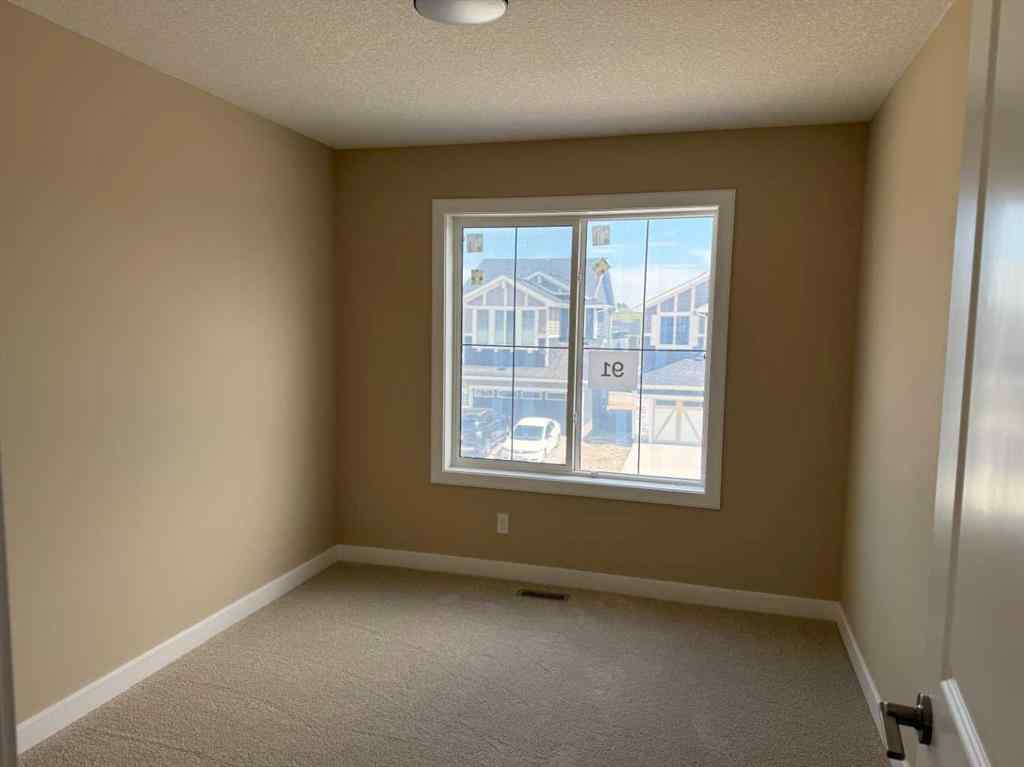MLS® A2228402 - 91 Sundown Crescent  in Sunset Ridge Cochrane, Residential
