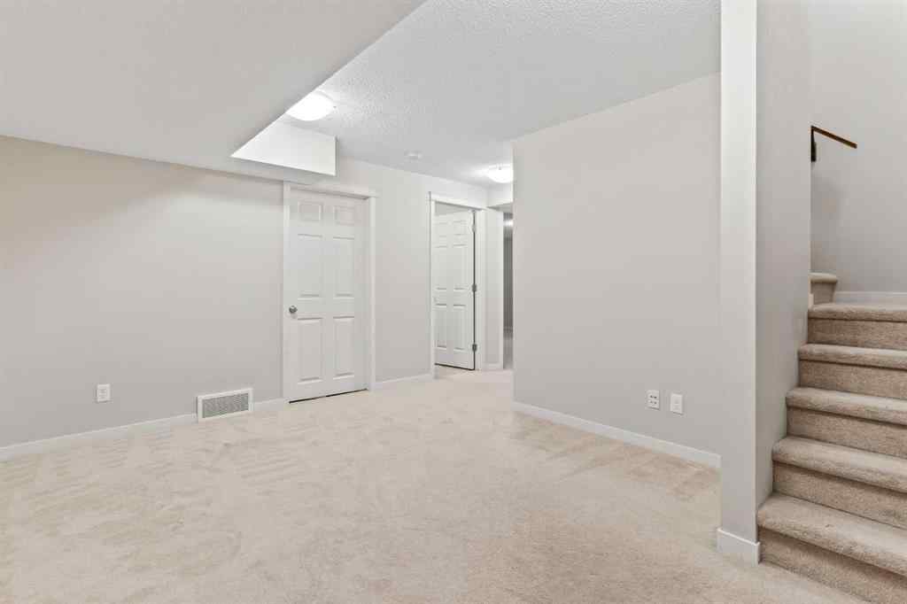 MLS® A2228923 - 77 Auburn Glen Common SE in Auburn Bay Calgary, Residential