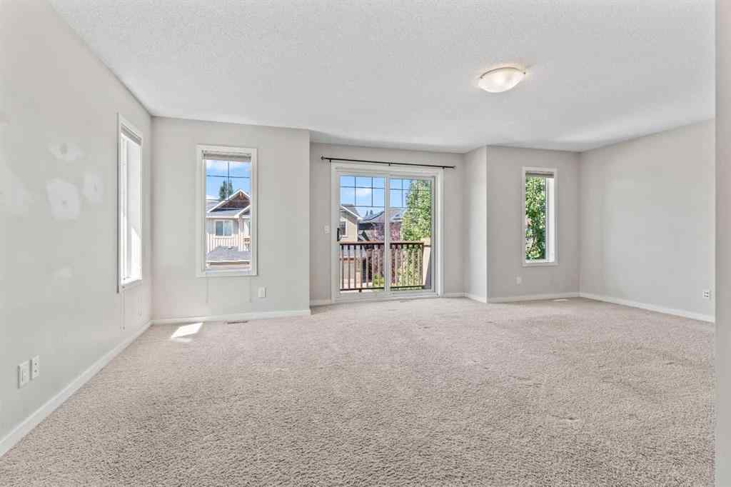 MLS® A2228923 - 77 Auburn Glen Common SE in Auburn Bay Calgary, Residential