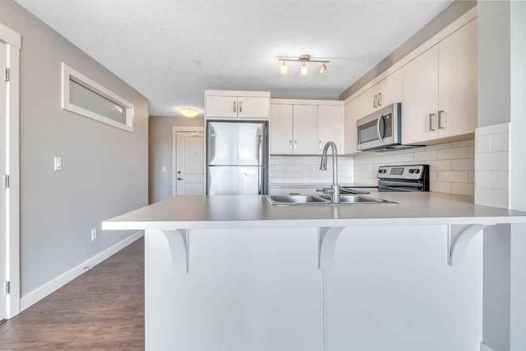 MLS® A2229060 - Unit #320 130 Auburn Meadows View SE in Auburn Bay Calgary, Residential