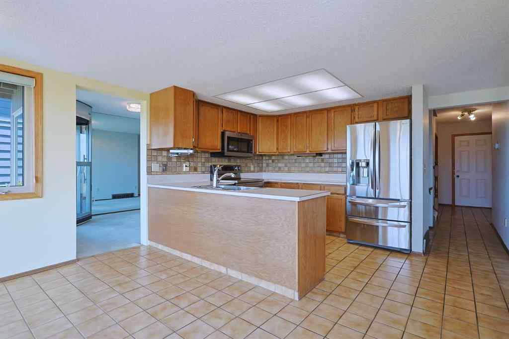 MLS® A2230579 - 7047 Edgemont Drive NW in Edgemont Calgary, Residential
