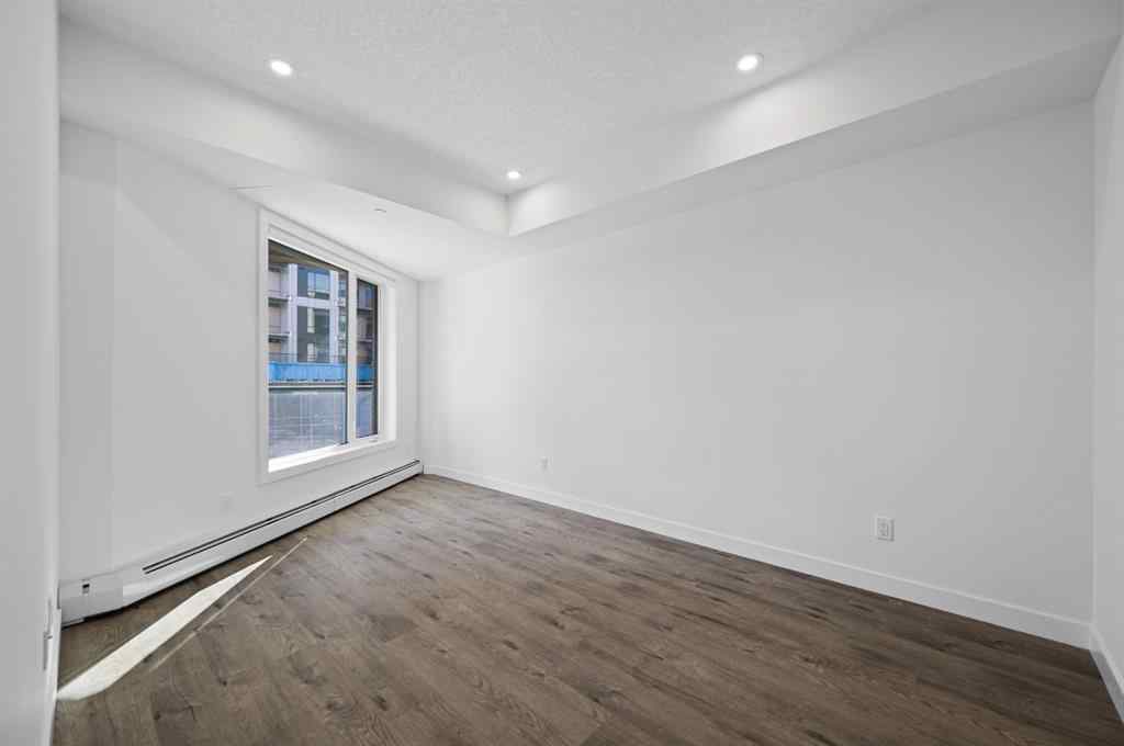 MLS® A2230875 - Unit #204 8370 Broadcast Avenue SW in West Springs Calgary, Residential