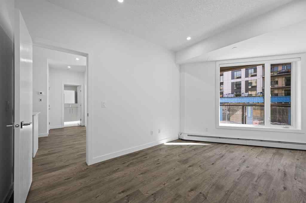 MLS® A2230875 - Unit #204 8370 Broadcast Avenue SW in West Springs Calgary, Residential