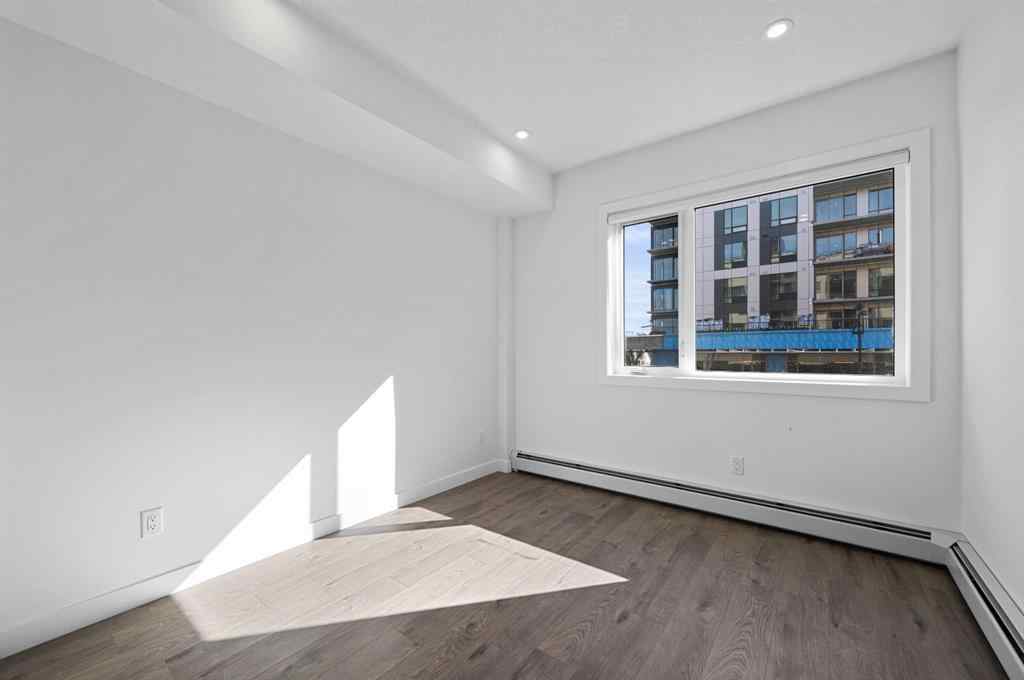 MLS® A2230875 - Unit #204 8370 Broadcast Avenue SW in West Springs Calgary, Residential