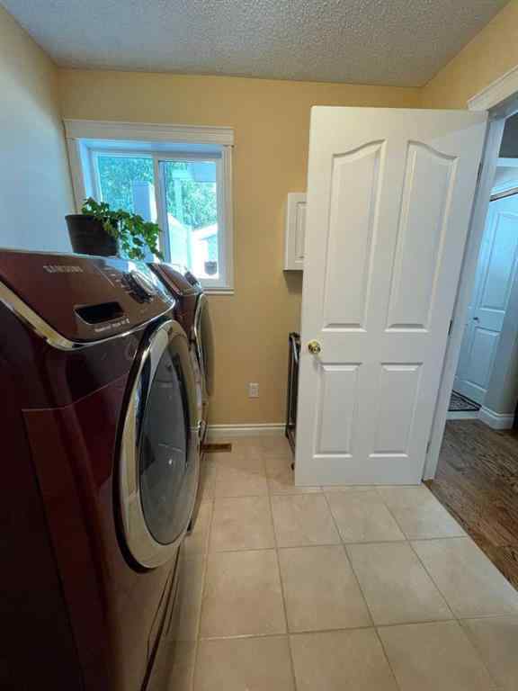 MLS® A2231023 - 24 Evergreen Park Close W in West End Brooks, Residential