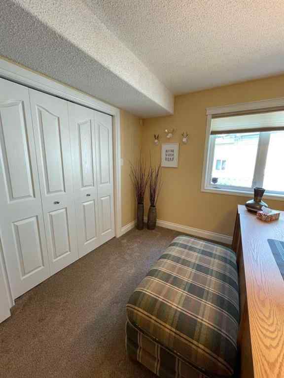 MLS® A2231023 - 24 Evergreen Park Close W in West End Brooks, Residential