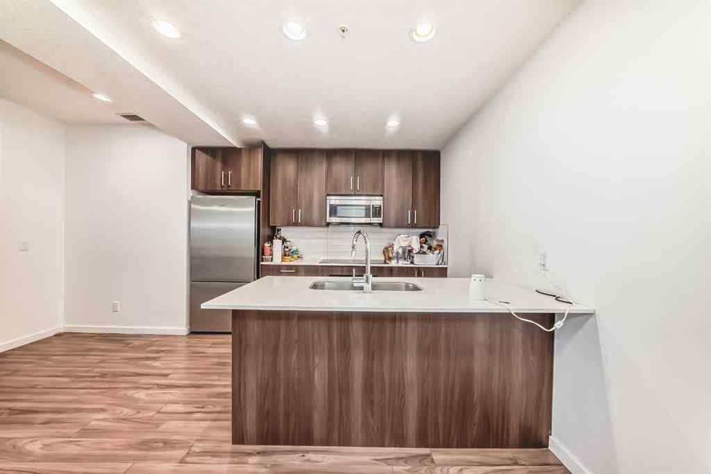 MLS® A2231094 - Unit #106 1629 38 Street SW in Rosscarrock Calgary, Residential