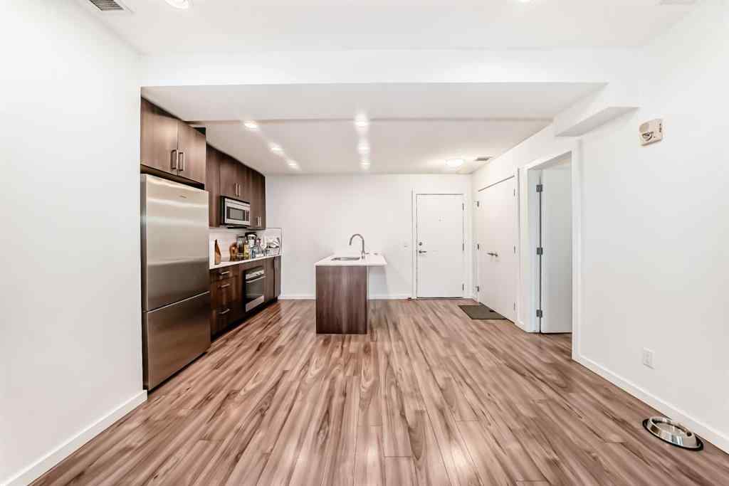 MLS® A2231094 - Unit #106 1629 38 Street SW in Rosscarrock Calgary, Residential