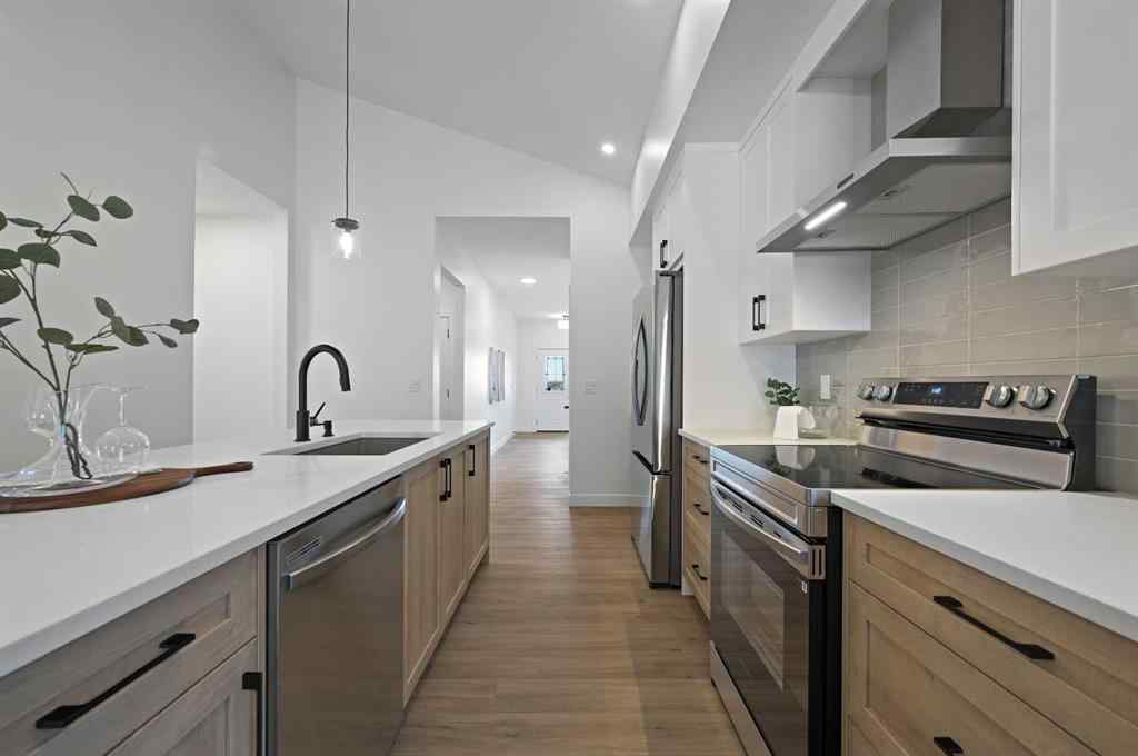 MLS® A2231479 - 13 Bayview Mews SW in Bayview Airdrie, Residential