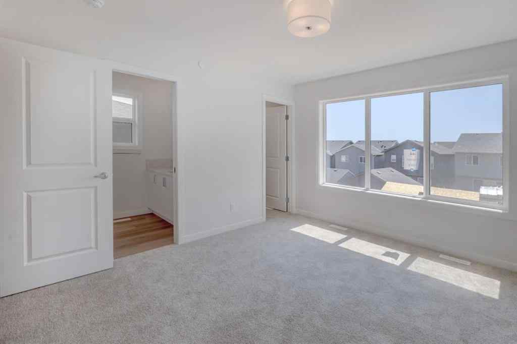 MLS® A2232075 - 44 Herron Walk NE in Livingston Calgary, Residential