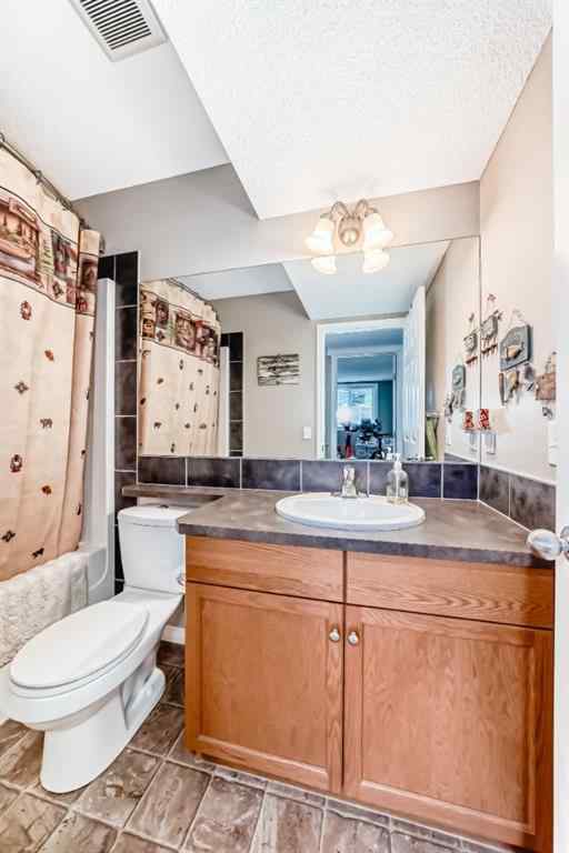MLS® A2232523 - 65 Sunset Heights  in Sunset Ridge Cochrane, Residential