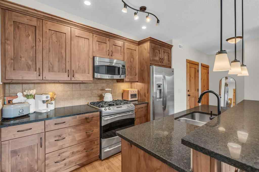 MLS® A2232578 - Unit #201 2100B STEWART CREEK Drive  in Three Sisters Canmore, Residential