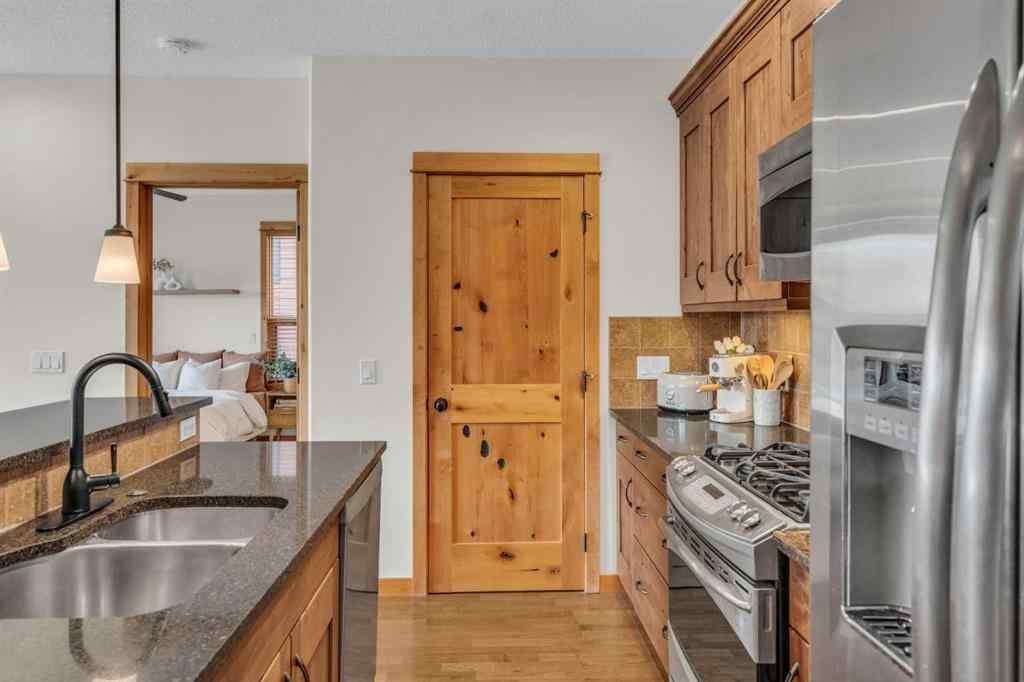 MLS® A2232578 - Unit #201 2100B STEWART CREEK Drive  in Three Sisters Canmore, Residential