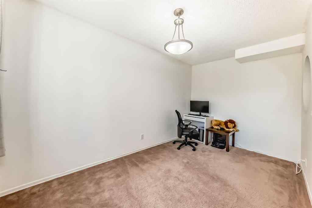 MLS® A2232768 - Unit #111 3015 51 Street SW in Glenbrook Calgary, Residential