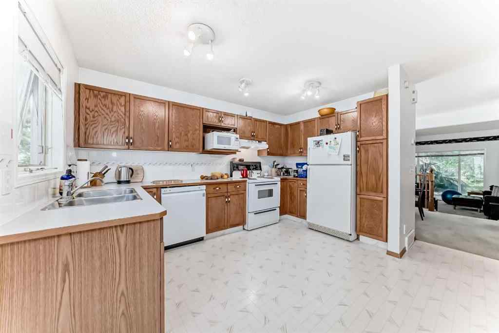 MLS® A2232962 - 12 Stradwick Rise SW in Strathcona Park Calgary, Residential
