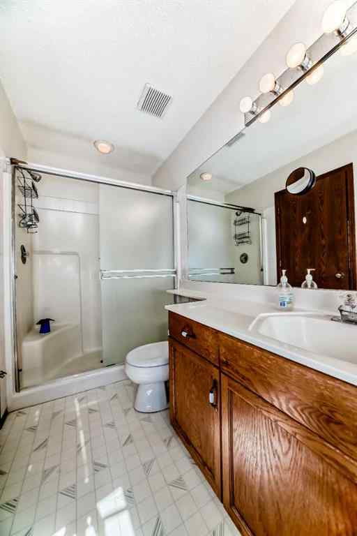 MLS® A2232962 - 12 Stradwick Rise SW in Strathcona Park Calgary, Residential