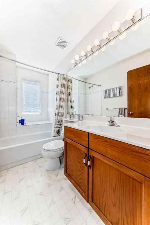 MLS® A2232962 - 12 Stradwick Rise SW in Strathcona Park Calgary, Residential