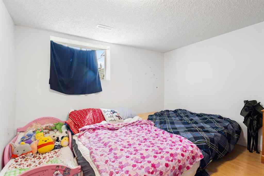 MLS® A2233167 - 703 130 Avenue SW in Canyon Meadows Calgary, Residential
