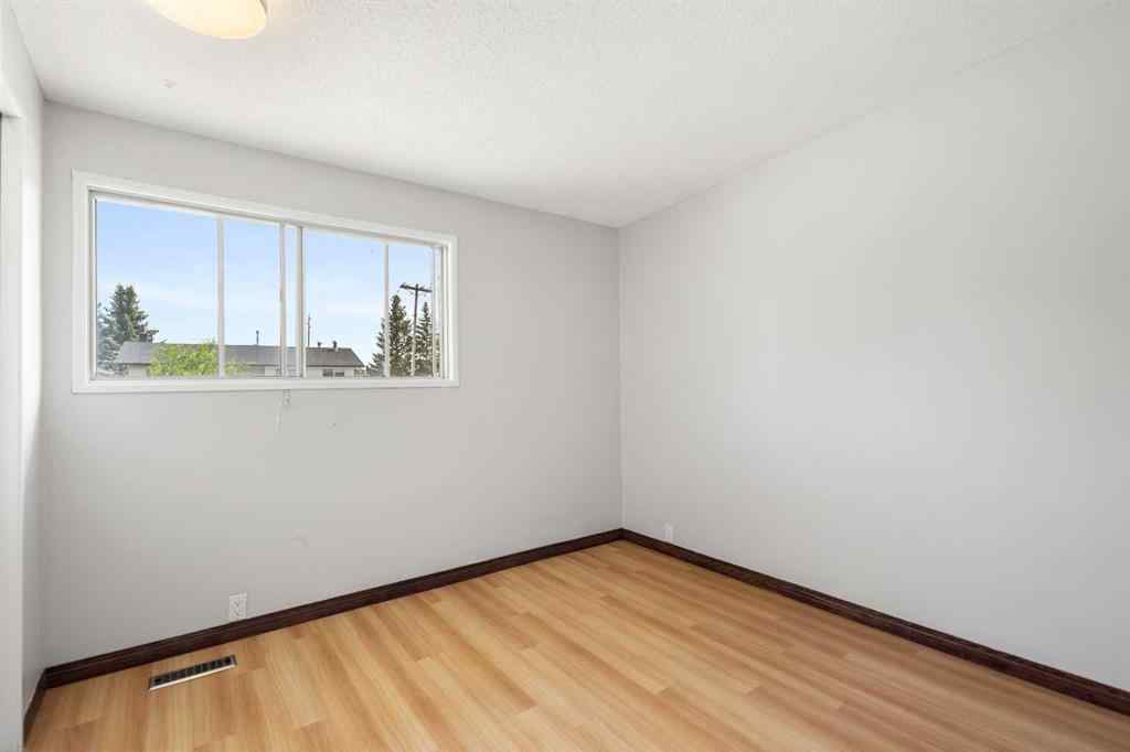 MLS® A2233167 - 703 130 Avenue SW in Canyon Meadows Calgary, Residential