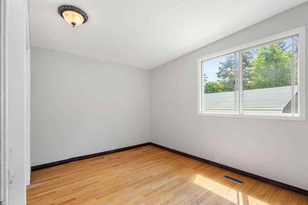 MLS® A2233167 - 703 130 Avenue SW in Canyon Meadows Calgary, Residential