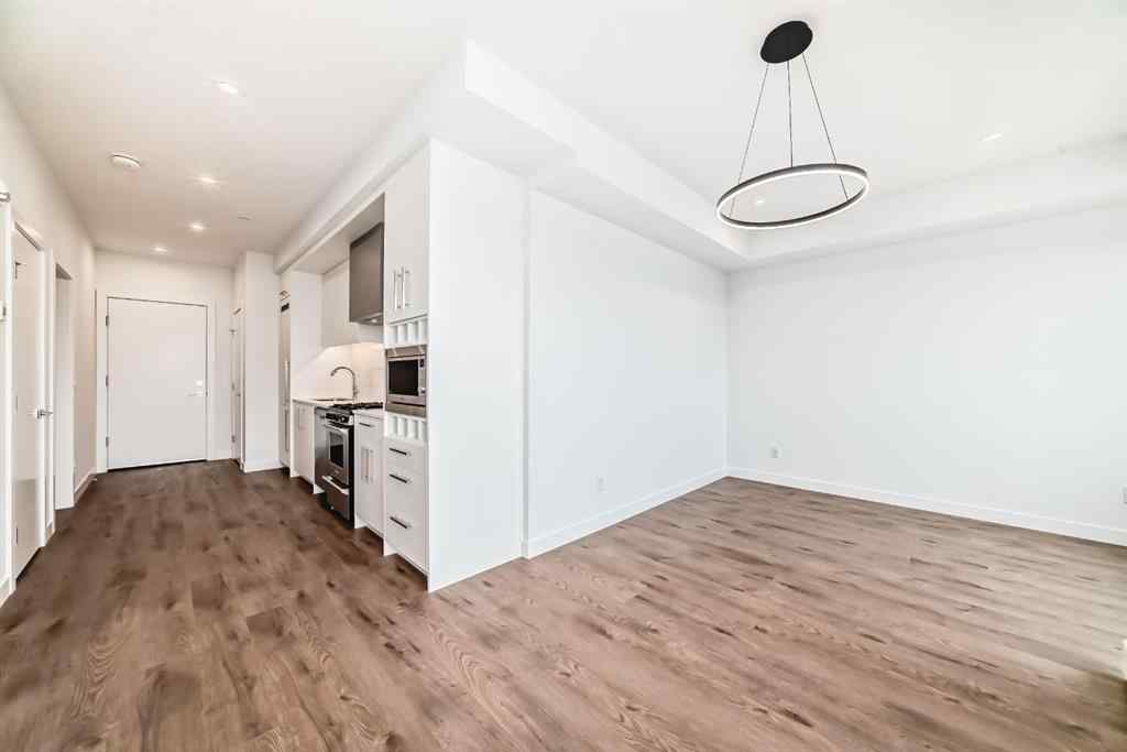 MLS® A2233786 - Unit #411 8230 Broadcast Avenue SW in West Springs Calgary, Residential