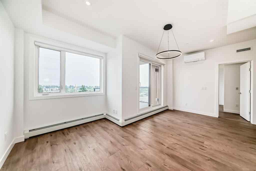 MLS® A2233786 - Unit #411 8230 Broadcast Avenue SW in West Springs Calgary, Residential
