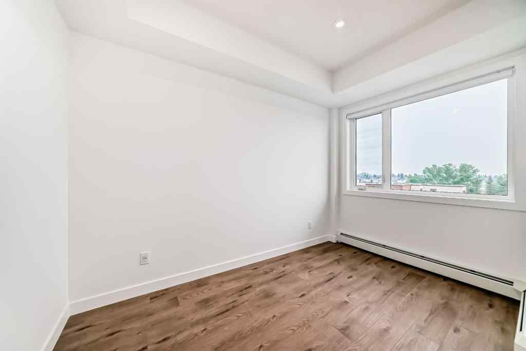 MLS® A2233786 - Unit #411 8230 Broadcast Avenue SW in West Springs Calgary, Residential