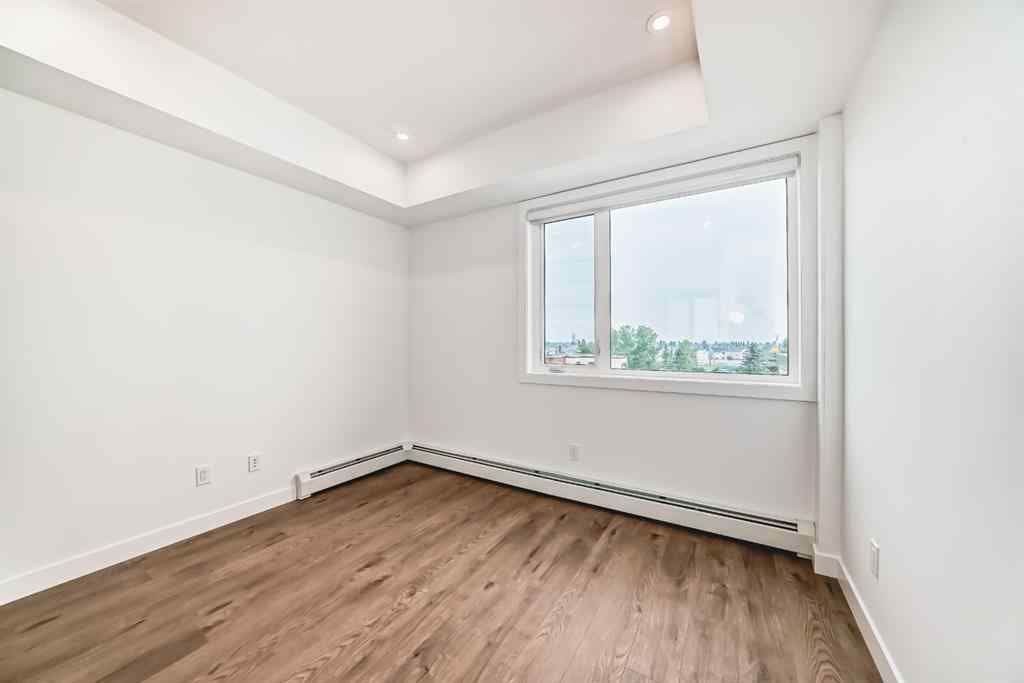 MLS® A2233786 - Unit #411 8230 Broadcast Avenue SW in West Springs Calgary, Residential
