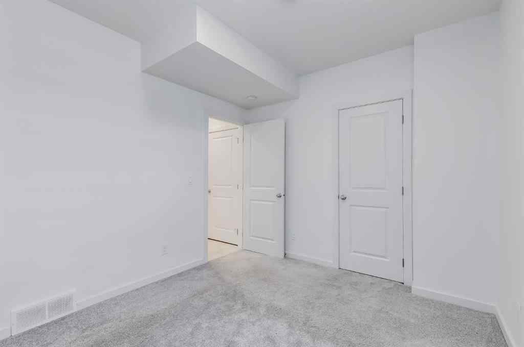 MLS® A2235108 - 61 Belmont Drive SW in Belmont Calgary, Residential