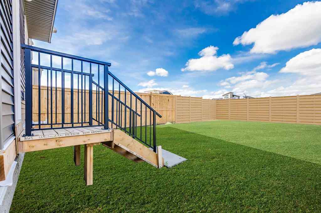 MLS® A2235108 - 61 Belmont Drive SW in Belmont Calgary, Residential