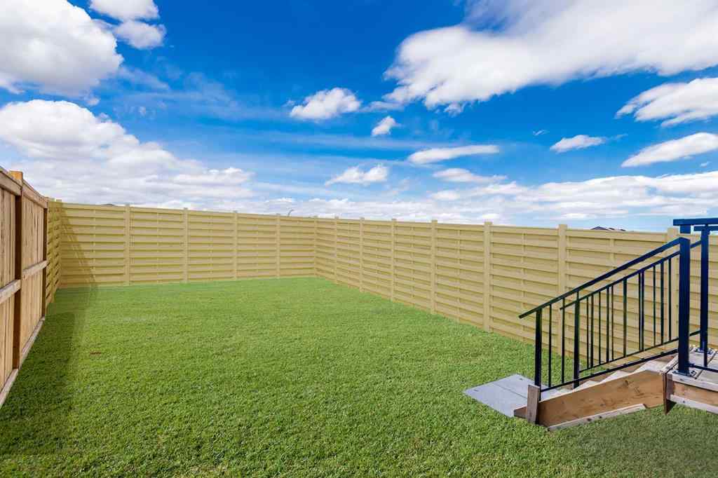 MLS® A2235108 - 61 Belmont Drive SW in Belmont Calgary, Residential