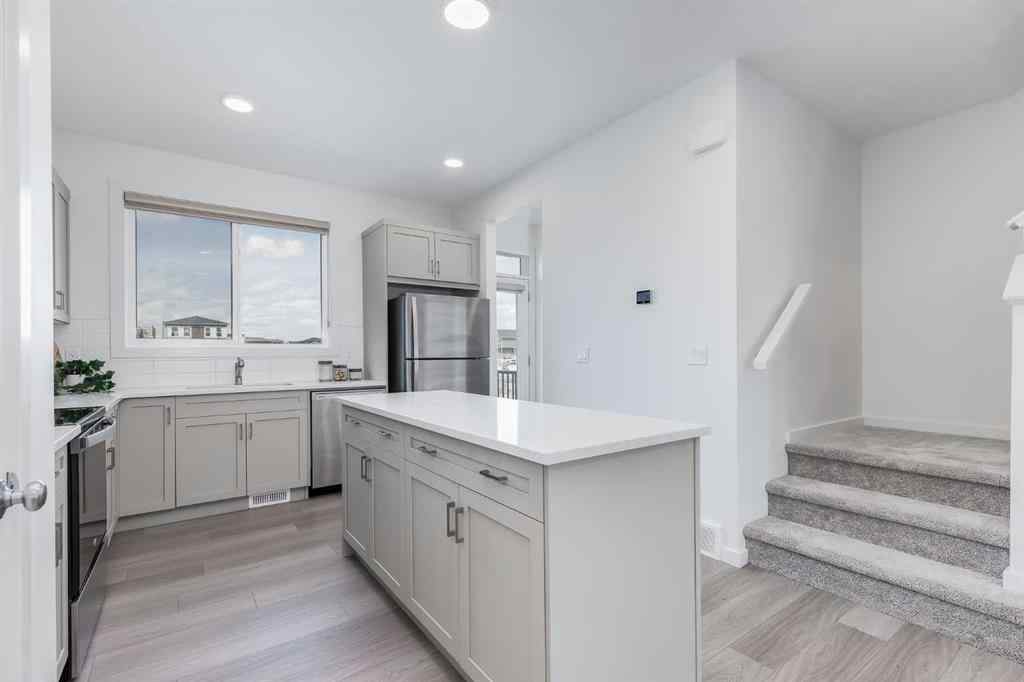 MLS® A2235108 - 61 Belmont Drive SW in Belmont Calgary, Residential