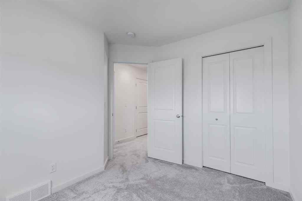 MLS® A2235108 - 61 Belmont Drive SW in Belmont Calgary, Residential