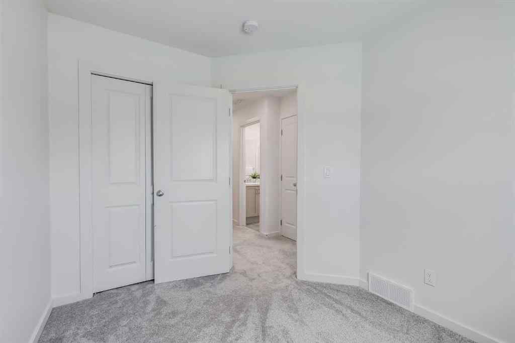 MLS® A2235108 - 61 Belmont Drive SW in Belmont Calgary, Residential