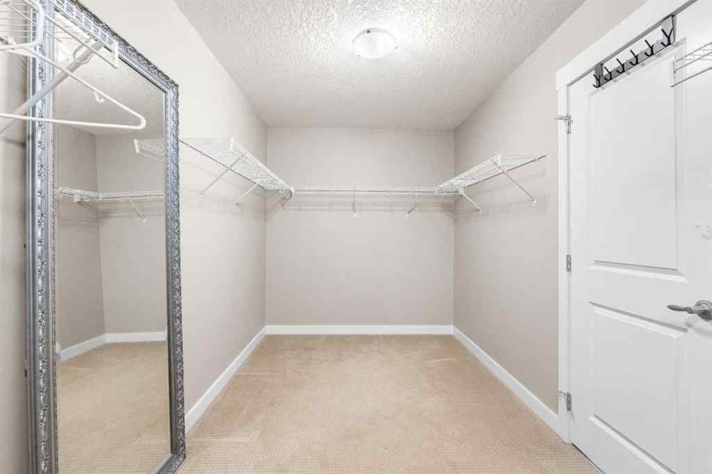 MLS® A2235404 - 156 Rainbow Falls Manor  in Rainbow Falls Chestermere, Residential