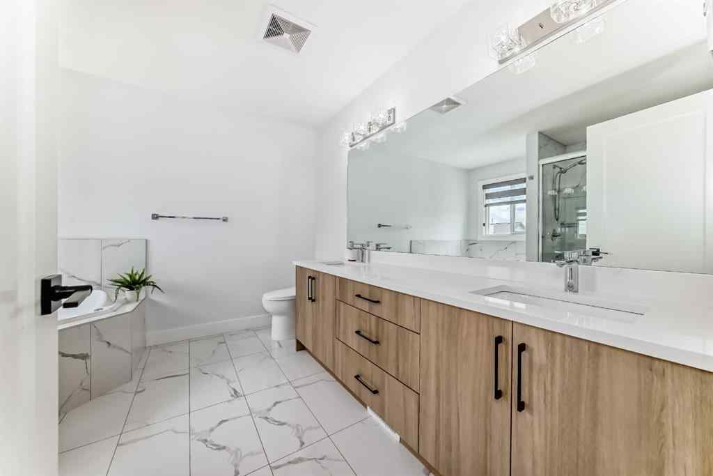 MLS® A2235594 - 127 Saddlecrest Grove NE in Saddle Ridge Calgary, Residential