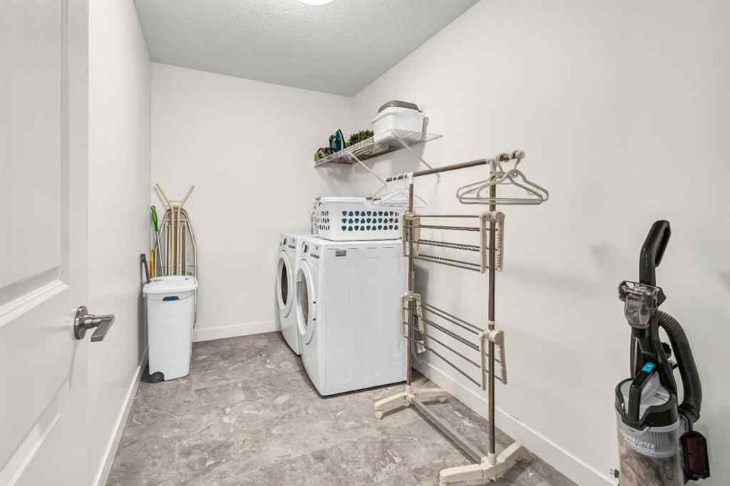 MLS® A2235640 - 890 Bluerock Way SW in Alpine Park Calgary, Residential