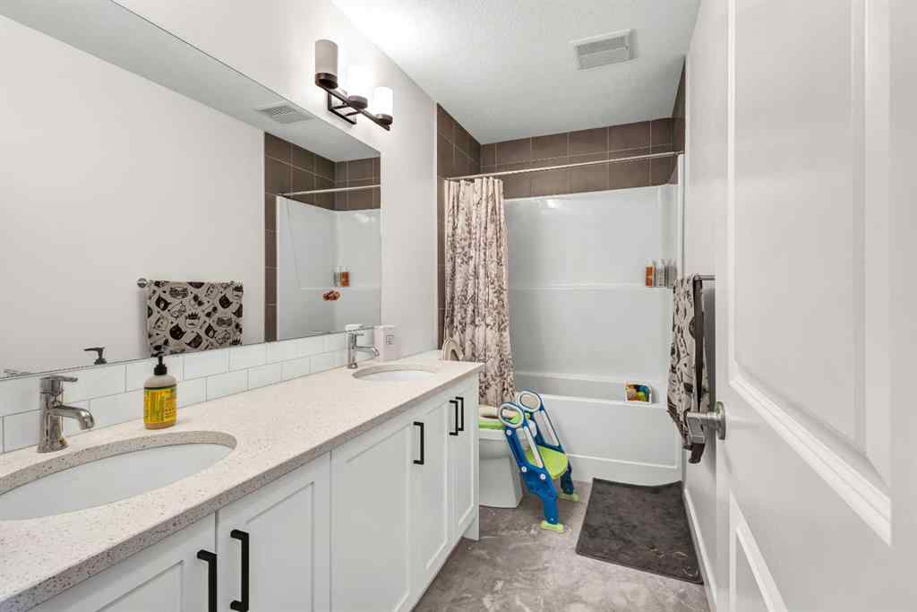 MLS® A2235640 - 890 Bluerock Way SW in Alpine Park Calgary, Residential