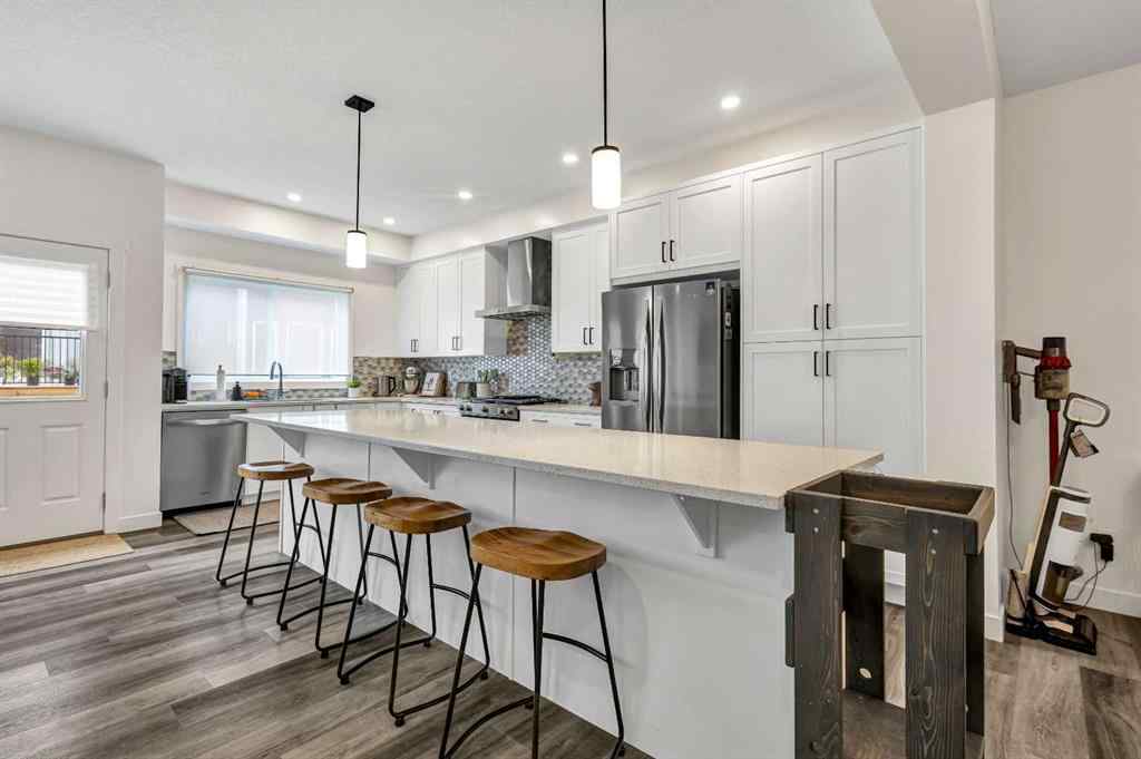 MLS® A2235640 - 890 Bluerock Way SW in Alpine Park Calgary, Residential