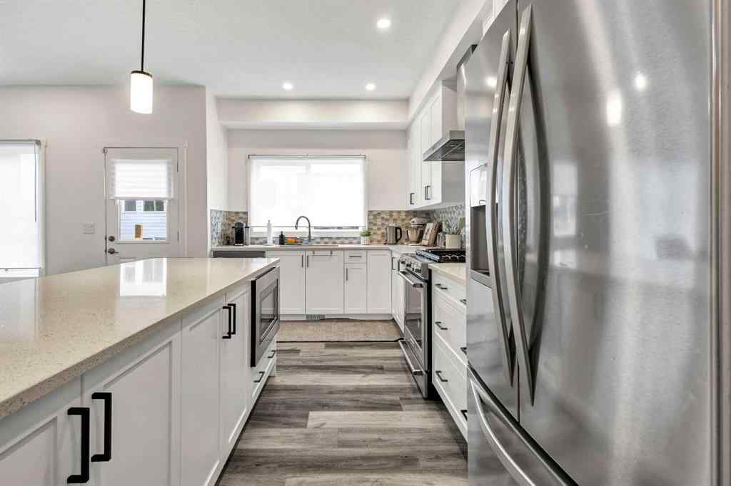 MLS® A2235640 - 890 Bluerock Way SW in Alpine Park Calgary, Residential