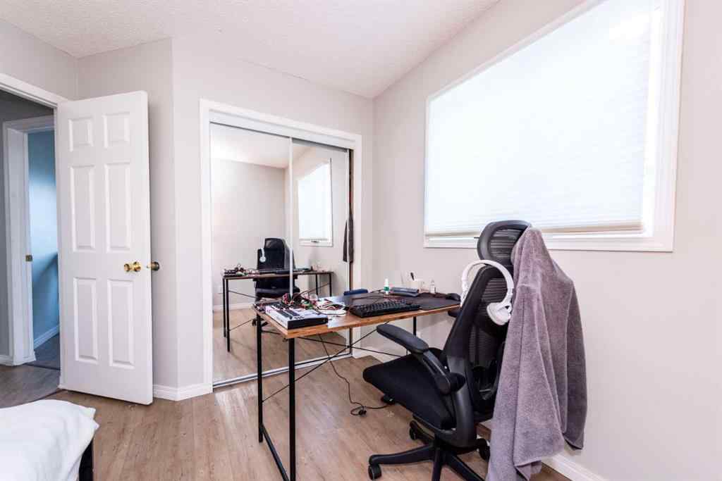 MLS® A2235682 - 214 Erin Circle SE in Erin Woods Calgary, Residential