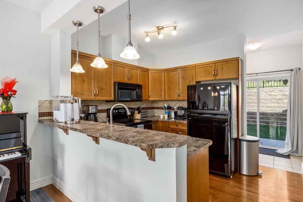 MLS® A2235988 - Unit #7 156 Rockyledge View NW in Rocky Ridge Calgary, Residential