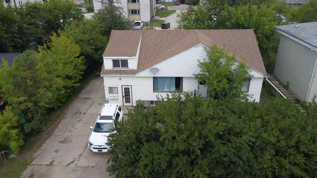 MLS® A2236685 - 10120 103 Avenue  in Avondale Grande Prairie, Multi-Family