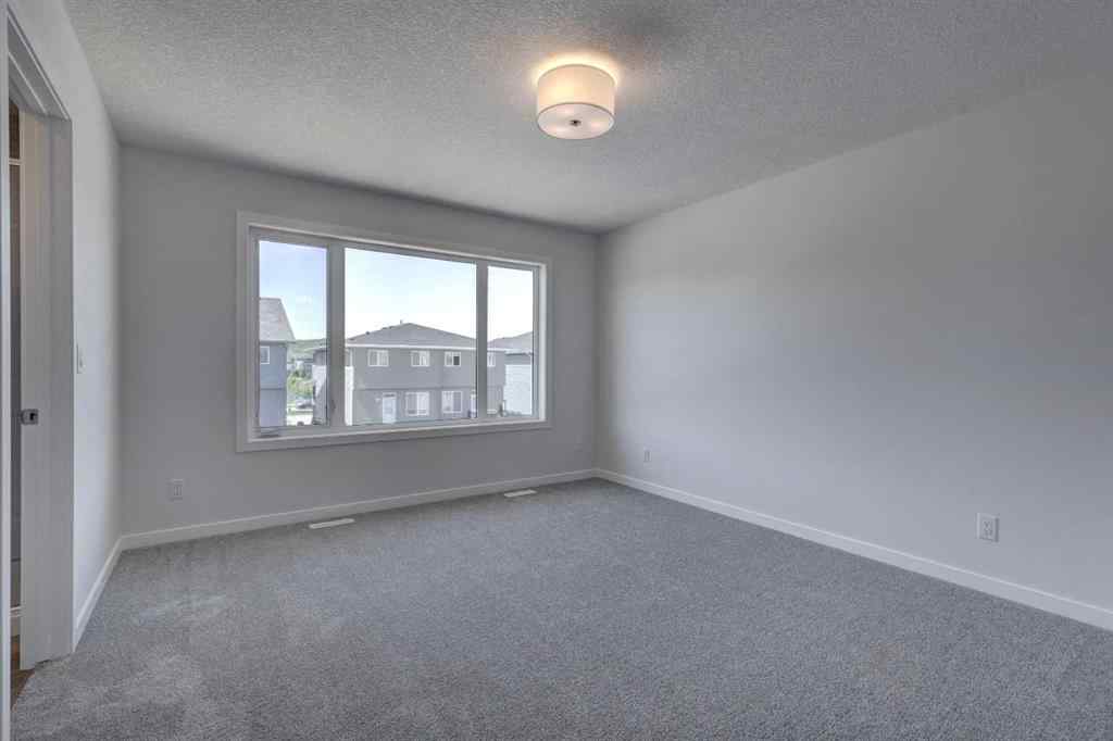 MLS® A2237059 - 232 Creekstone Circle SW in Pine Creek Calgary, Residential
