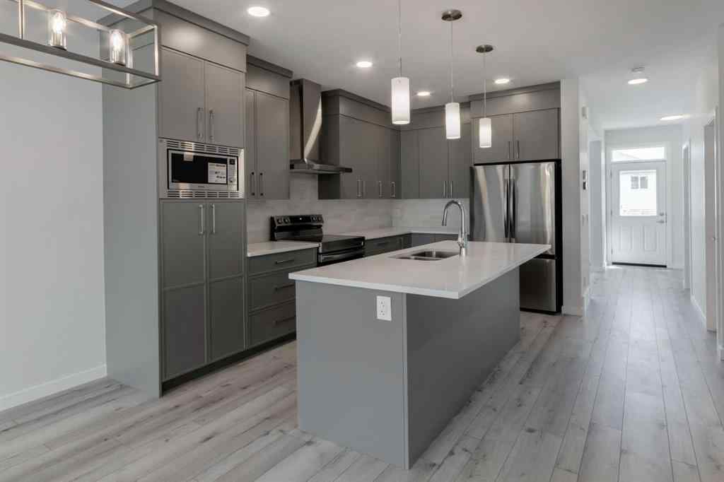 MLS® A2237065 - 909 Livingston View NE in Livingston Calgary, Residential